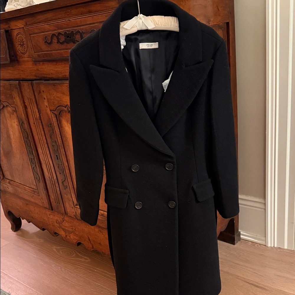 Prada Classic Black wool dress coat, elegant and well tailored. Fully lined.